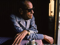 Naguib Mahfouz at the Ali Baba Cafe in Cairo, Egypt. Mahfouz  won the 1988 Nobel Prize in literature, the first writer in Arabic to be so honored. Mahfouz is famous for capturing in fiction, the settings and everyday lives of Cairo people. At times, various governments banned his books. Ali Baba Cafe in Cairo, Egypt. He was 78 in 1990.