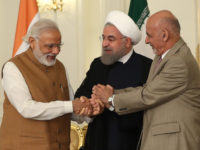 TEHRAN, IRAN - MAY 23: President of Afghanistan Ashraf Ghani (R), Prime Minister of India Narendra Modi (L) and President of Iran Hassan Rouhani (C) shake hands after they signed Chabahar transit agreement in Tehran, Iran on May 23, 2016.



 (Photo by Pool / Iran Presidency/Anadolu Agency/Getty Images)