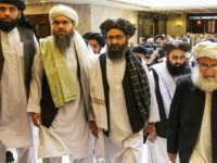 FILE - In this May 28, 2019 file photo, Mullah Abdul Ghani Baradar, the Taliban group's top political leader, third from left, arrives with other members of the Taliban delegation for talks in Moscow, Russia. U.S. envoy Zalmay Khalilzad and the Taliban have resumed negotiations on ending America’s longest war. A Taliban member said Khalilzad also had a one-on-one meeting on Wednesday, Aug. 21, 2019, with  Baradar, the Taliban’s lead negotiator, in Qatar, where the insurgent group has a political office. (AP Photo/Alexander Zemlianichenko, File)