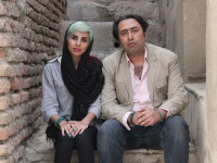 In this undated photo made available by International Campaign for Human Rights in Iran, Iranian poets Fatemeh Ekhtesari , left, and Mehdi Mousavi pose in unknown place in Iran. Two Iranian poets known for prose probing modern life face years in prison for their work and 99 lashes apiece for shaking hands with members of the opposite sex, the latest targets of a crackdown on expression in the Islamic Republic. (International Campaign for Human Rights in Iran via AP)