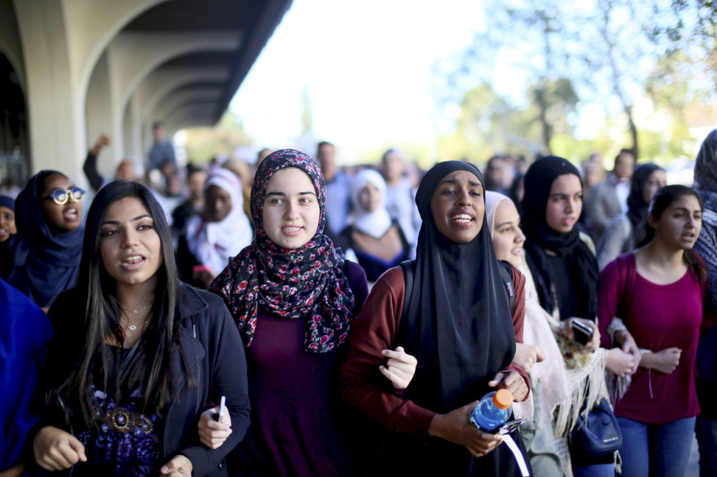 Students chant while marching at a rally against Islamophobia at San Diego State University in San Diego, California, November 23, 2015. REUTERS/Sandy Huffaker - RTX1VIPU
