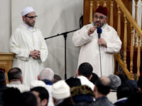 FILE - In this Friday, Nov. 20, 2015 file photo, Imam Mustafa Kastit, left, and President of the League of Imams in Belgium, Mohammed Tojgani, right, speak after leading prayer at the al-Khalil mosque in Molenbeek, Belgium. (AP Photo/Francois Walschaerts, File)