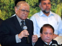 Former Pakistani prime minister Nawaz Sharif (R) listens as his newly-named party candidate for the upcoming presidential election Saeed uz Zaman Siddiqui (L) addresses a press conference in Islamabad on August 25, 2008.  Sharif named former judge Saeed uz Zaman Siddiqui as his party's candidate for presidential polls scheduled for September 6. "We have requested Saeed us Zaman Siddiqui to accept our offer to become presidential candidate," Sharif told a news conference after a crucial meeting of his Pakistan Muslim League-Nawaz (PML-N).    AFP PHOTO/Farooq NAEEM (Photo credit should read FAROOQ NAEEM/AFP/Getty Images)