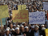 Pakistani students of Islamic seminaries take part in a rally in support of blasphemy laws, in Islamabad, Pakistan, Wednesday, March 8, 2017. Hundreds of students rallied in the Pakistani capital, Islamabad, urging government to remove blasphemous content from social media and take stern action against those who posted blasphemous content on social media. The placard, center, in Urdu reads, "Authorized Institutions immediately take action on the incidents of blasphemy and remove blasphemous content on social media." (AP Photo/Anjum Naveed)
