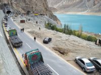 To go with story 'Pakistan-China-economy-transport, FEATURE' by Guillaume LAVALLÉE
In this photograph taken on September 29, 2015, Pakistani commuters wait to travel through a newly built tunnel in northern Pakistan's Gojal Valley.  A glossy highway and hundreds of lorries transporting Chinese workers by the thousands: the new Silk Road is under construction in northern Pakistan, but locals living on the border are yet to be convinced they will receive more from it than dust.    AFP PHOTO / Aamir QURESHI
