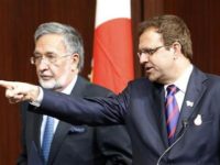 Afghanistan's Finance Minister Omar Zakhilwal (R) gestures next to Foreign Minister Zalmai Rassoul at their joint news conference with Japan's Foreign Minister Koichiro Gemba at the Tokyo Conference on the Reconstruction of Afghanistan in Tokyo July 8, 2012. REUTERS/Kim Kyung-Hoon