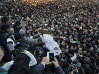 SRINAGAR, INDIA - OCTOBER 29: Kashmiri villagers carry the body of top Lashkar-e-Taiba commander Abu Qasim during his funeral procession on October 29, 2015 in Bugam district Kulgam some 75 km from Srinagar, India. Police on Thursday claimed that the most wanted LeT Commander Abu Qasim was killed during an encounter in Khandaypora area of Kulgam district, south Kashmir. (Photo by Waseem Andrabi/Hindustan Times via Getty Images)